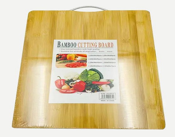 How does using vinegar to disinfect cutting boards help prevent stains and discoloration?